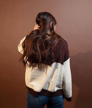 Close-up of the soft knit texture on POL cream sweater
