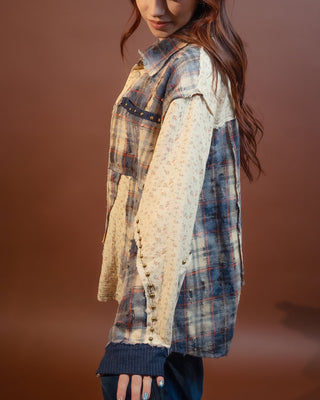Close-up of stud detail and floral contrast panel on POL shirt