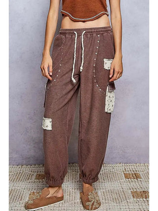 POL choco French terry low-rise joggers with floral rivets and printed patches