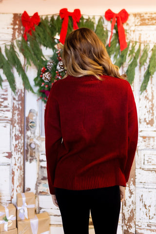 Back view of oversized Duck the Halls chunky knit ski sweater