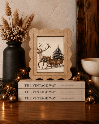 Reindeer and sleigh Christmas framed canvas art with scalloped arch shape