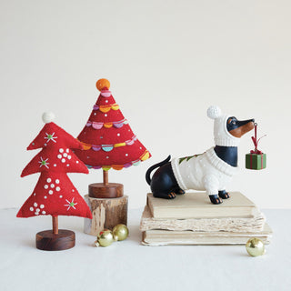 Detail view of multicolor resin dachshund keepsake box with wrapped present