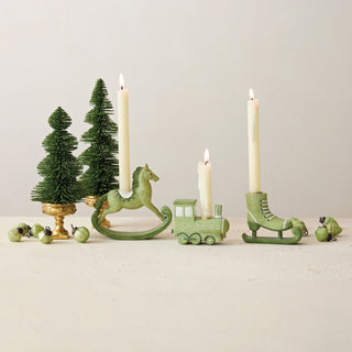 Styled view of sage green train taper holder