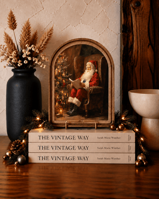 Santa reading Christmas arch canvas art in a stained wood frame for holiday decor