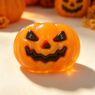 Judson Co. black and orange jack-o'-lantern squishy toy with grinning face