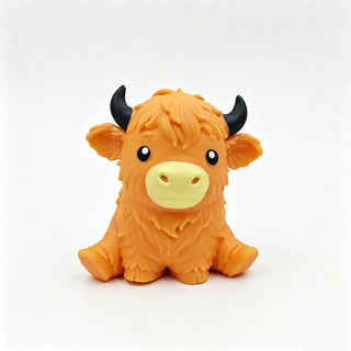 Tan Highland cow squishy toy with shaggy coat and curved horns