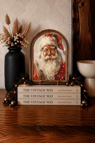 Small snowy Santa Christmas arch framed art for holiday shelf styling