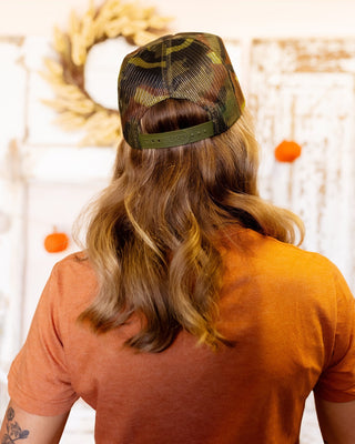 Alternate pin finish option on spooky full camo skeleton trucker hat
