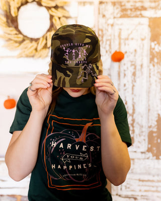 Full camo foam trucker hat with skeleton graphic and removable skeleton pin