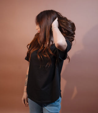 Side view of Stitch & Co black short sleeve knit top, Homestead style