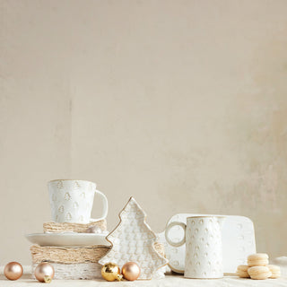 White stoneware Christmas tree plate with embossed trees and gold accents