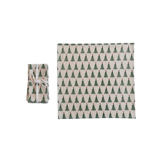 Styled view of stonewashed cotton napkins with green and red tree print