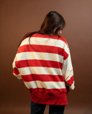Side view of Red and white striped terry pocket sweatshirt