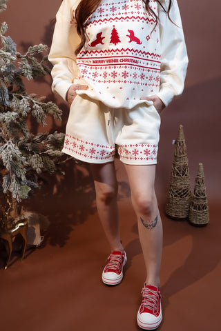 Detail view of elastic waist and adjustable drawstring on cream fleece sweatshorts