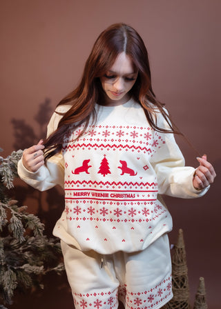 Styled view of oversized fleece Christmas sweatshirt with red Fair Isle embroidery and holiday dachshunds