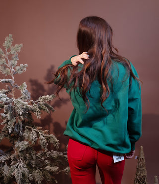 Side view of relaxed-fit North Pole Rodeo Santa fleece sweatshirt