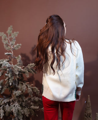 Another angle of skiing bear graphic sweater showing ribbed knit trim