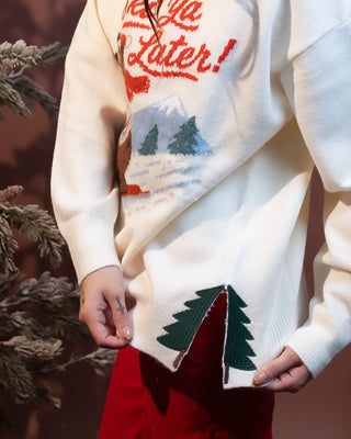 Close-up of ribbed mock neckline on soft knit ski graphic sweater