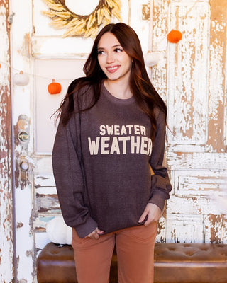 Brown Sweater Weather knit sweatshirt with cream puff ink lettering and crewneck