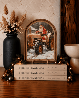 Tractor Santa arch framed art print, a cheerful farmhouse Christmas wall or mantel piece