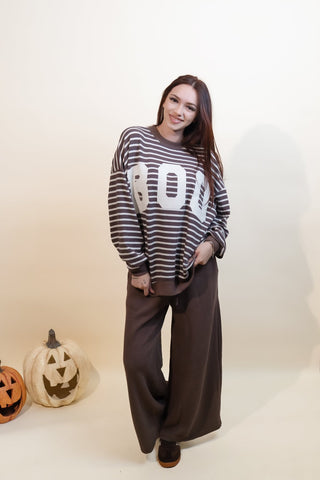 Back view of brown striped Boo Season knit top