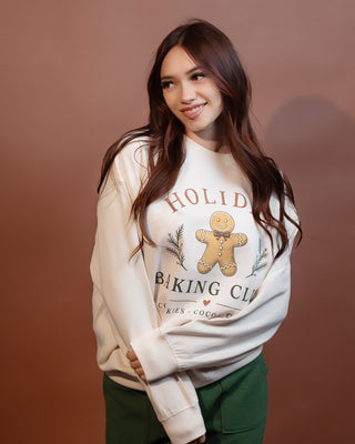 Close-up of the Holiday Baking Club graphic on ivory sweatshirt
