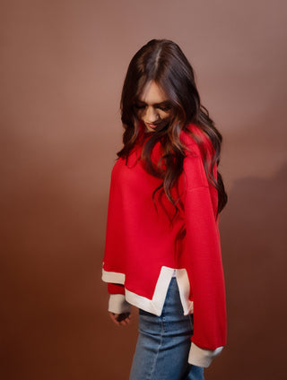 Close-up of soft cloudy knit fabric on long sleeve top
