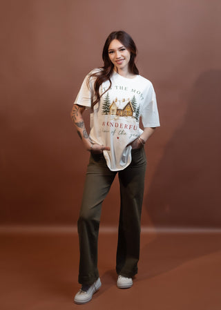Styled view of ivory graphic tee with Most Wonderful Time Of The Year Christmas print