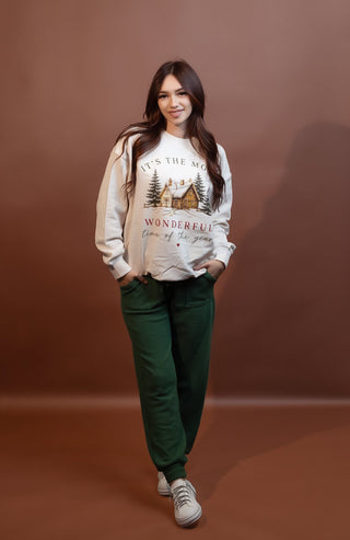 Styled view of soft cloudy knit pocket joggers with slim silhouette and cuffed hems
