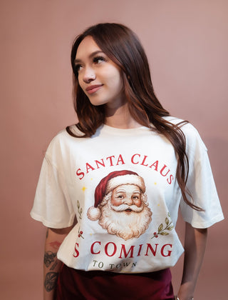 Close-up of Santa Claus Is Coming To Town graphic print on tee