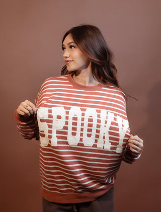 Back view of long-sleeve Halloween stripe knit top