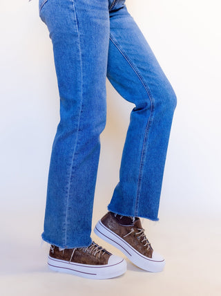 Side view of Very G Harmon chocolate sneaker on tall white platform