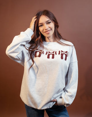 Gray pearl sweatshirt with embroidered football and bow design for game day