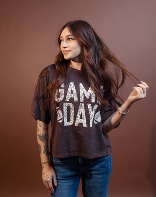 Football graphic mineral tee styled on model for game day