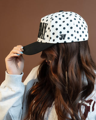 Side view of Spot On polka dot game day cap with signature branding