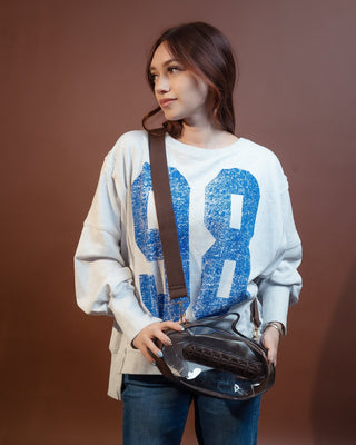 Clear stadium crossbody bag styled on model for game day
