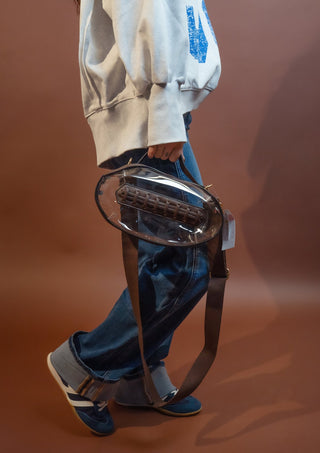 Side view of clear waterproof crossbody bag showing its depth