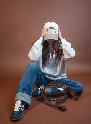 Side view of the houndstooth bill football snapback cap