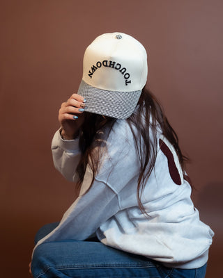 Touchdown cap with black and white houndstooth bill and puff embroidery
