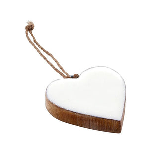 Styled view of set of enameled mango wood heart ornaments with jute string loops
