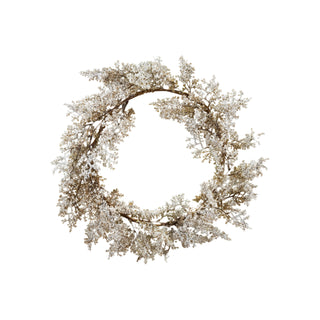 Round faux juniper wreath with snow finish